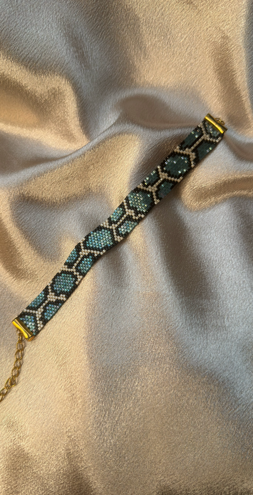 Beaded bracelet on a textured beige surface