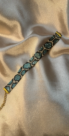 Beaded bracelet on a textured beige surface